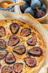 Image showing Pizza with figs, ricotta and honey.