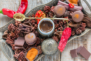 Image showing Black coffee and almond cakes with chilli.