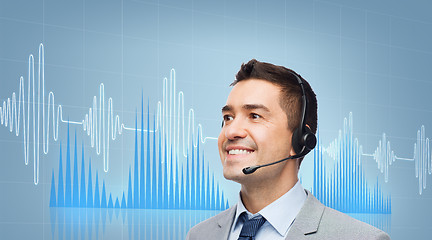 Image showing businessman in headset over sound wave or diagram