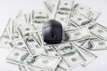 Image showing close up of computer mouse and dollar cash money