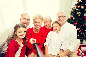 Image showing smiling family making selfie at home