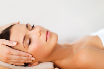 Image showing beautiful woman in spa salon having facial