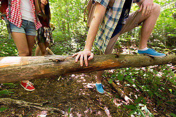 Image showing close up of friends with backpacks hiking