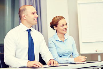 Image showing group of smiling businesspeople meeting in office