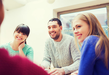 Image showing group of happy friends meeting and talking