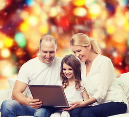 Image showing smiling family with laptop