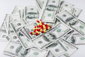 Image showing medical pills or drugs and dollar cash money