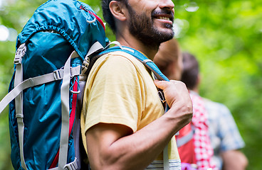 Image showing close up of friends with backpacks hiking