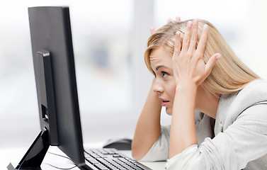 Image showing stressed woman with computer