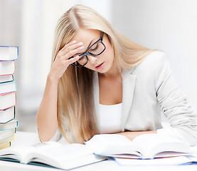 Image showing student with books and notes