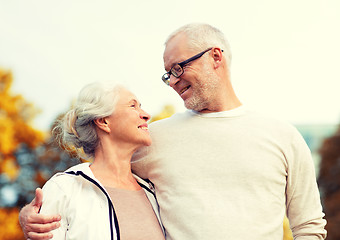 Image showing senior couple hugging in city park