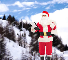 Image showing man in costume of santa claus with notepad and bag