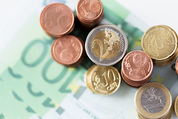 Image showing close up of euro paper money and coins on table