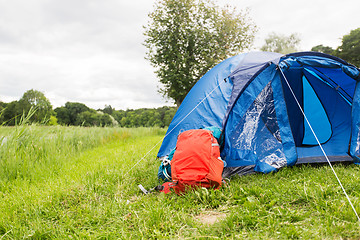 Image showing touristic tent and backpack outdoors