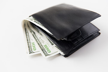 Image showing close up of dollar money in black leather wallet