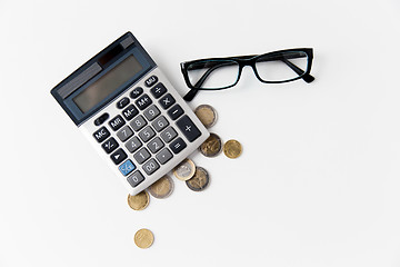 Image showing calculator, eyeglasses and euro coins on table