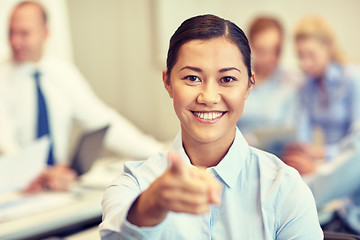 Image showing group of smiling businesspeople meeting in office