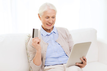 Image showing senior woman with tablet pc and credit card