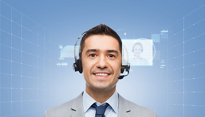 Image showing happy businessman in headset with virtual screens