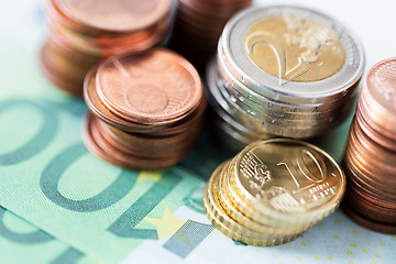 Image showing close up of euro paper money and coins on table