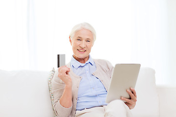 Image showing senior woman with tablet pc and credit card