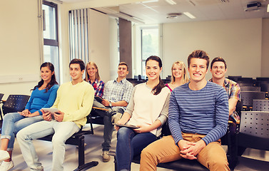 Image showing group of smiling students with tablet pc