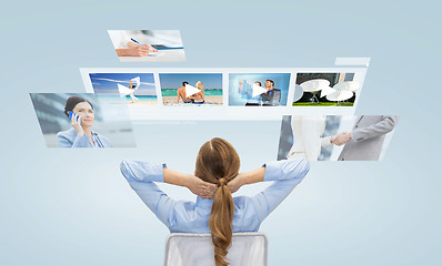 Image showing businesswoman watching video media files