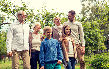 Image showing happy family in front of house outdoors