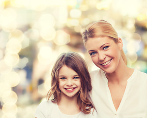 Image showing smiling mother and little girl