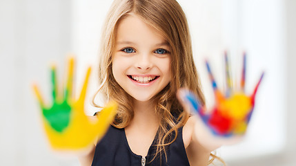 Image showing smiling girl showing painted hands