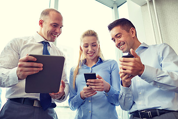 Image showing business people with tablet pc and smartphones