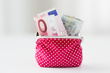 Image showing close up of euro paper money in pink wallet