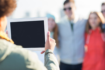 Image showing close up of friends with tablet pc photographing