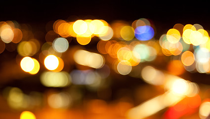 Image showing golden bright lights on dark night background