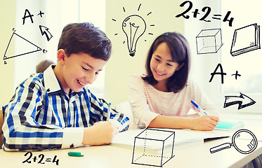 Image showing group of school kids writing test in classroom