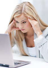 Image showing stressed woman with laptop