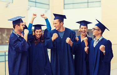 Image showing group of smiling students in mortarboards