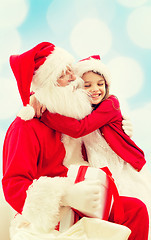 Image showing smiling little girl with santa claus