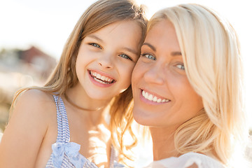 Image showing happy mother and child girl outdoors