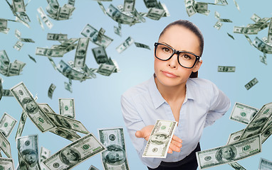 Image showing businesswoman with money over blue background