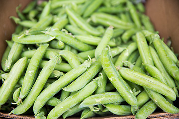 Image showing close up of green peas in box at street market