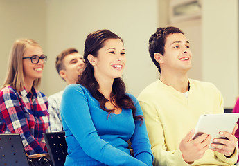 Image showing group of smiling students with tablet pc