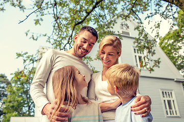 Image showing happy family in front of house outdoors