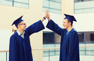 Image showing smiling students in mortarboards