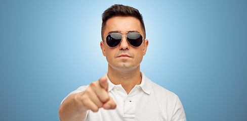 Image showing man in sunglasses pointing finger on you