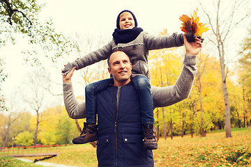 Image showing happy family having fun in autumn park