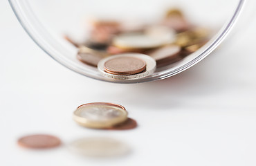 Image showing close up of euro coins in glass jar on table