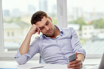 Image showing  businessman with smartphone  at office 