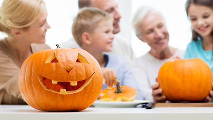 Image showing helloween pumpkin lantern over happy family