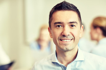 Image showing smiling businessman face in office